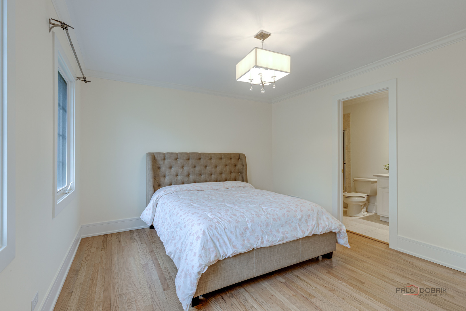 319 North County Line Road Hinsdale, IL 60521 - Photo 28 of 45 a bedroom with a bed and a lamp