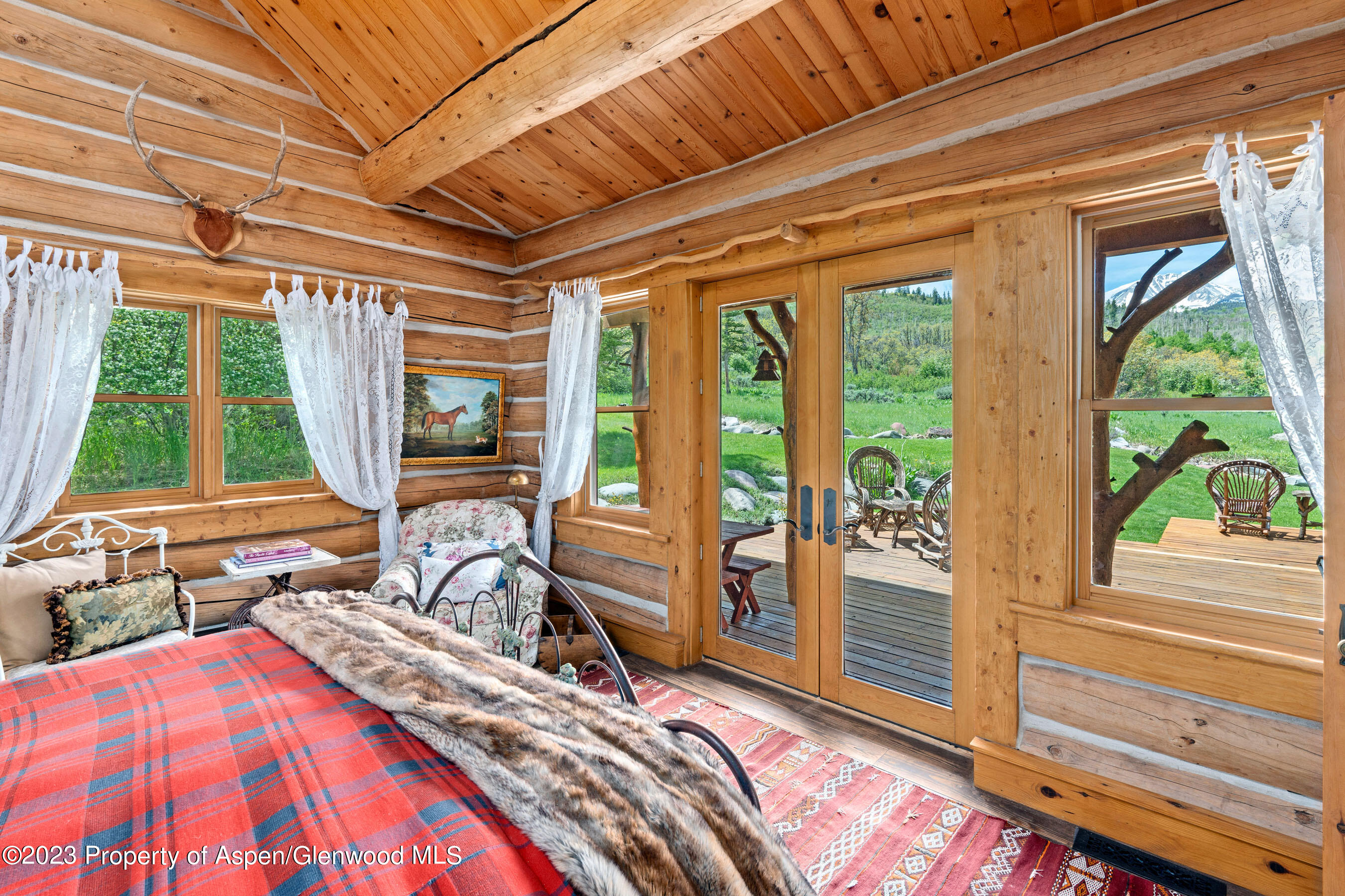 2088 Old Herron Road Basalt, CO 81621 - Photo 16 of 38 a bed sitting in a bedroom next to a window