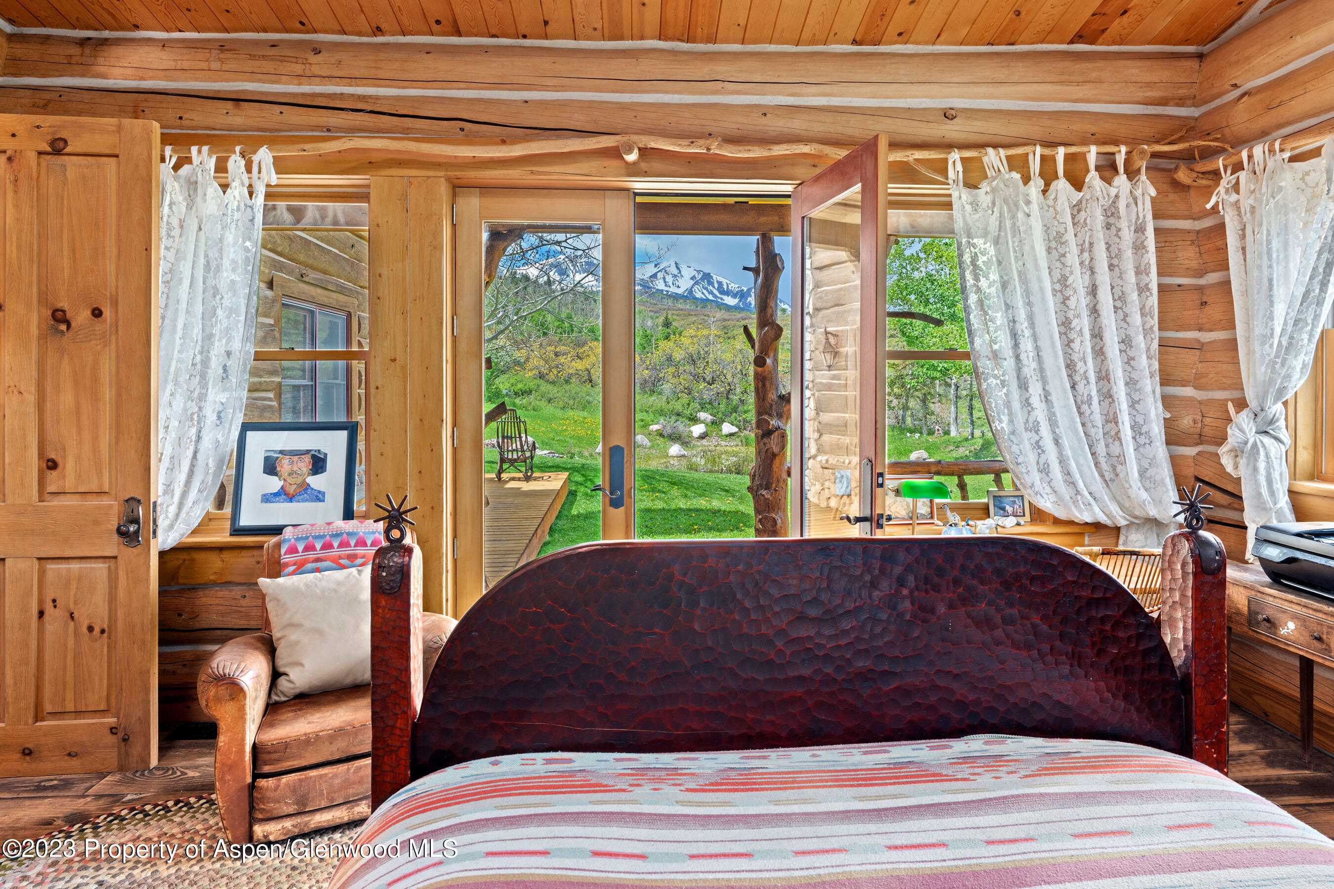 2088 Old Herron Road Basalt, CO 81621 - Photo 20 of 38 a bed sitting in a bedroom next to a window
