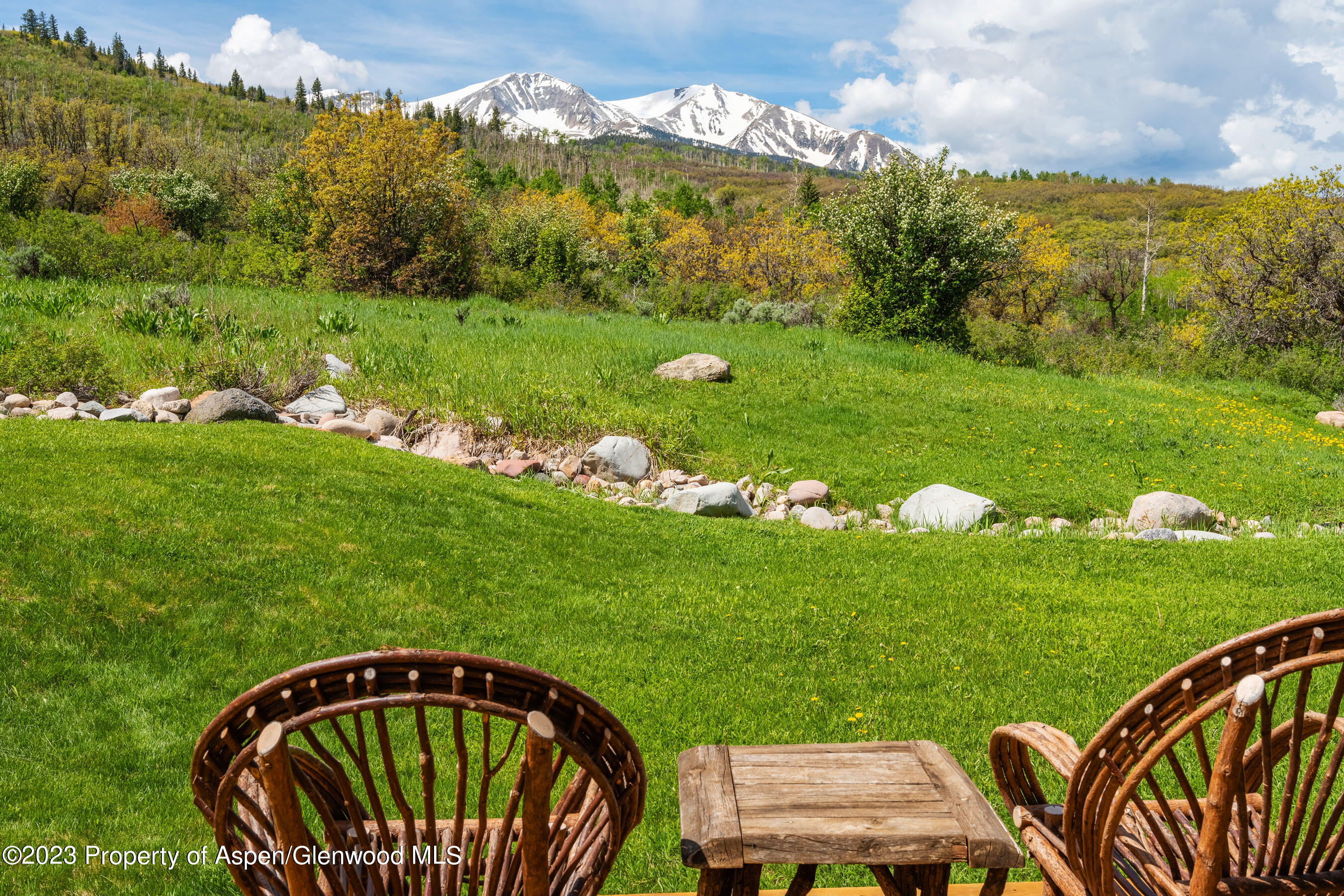 2088 Old Herron Road Basalt, CO 81621 - Photo 28 of 38 a view of a wooden table and chairs in the garden