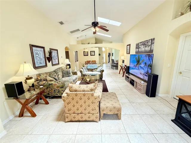 a bedroom with bed and a chandelier