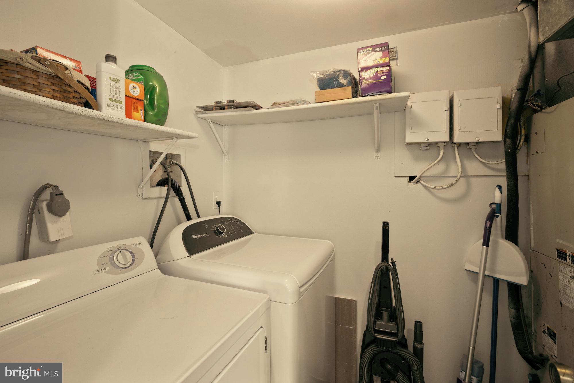 9122 Centerway Road Gaithersburg, MD 20879 - Photo 27 of 33 a view of storage and utility room with washer and dryer