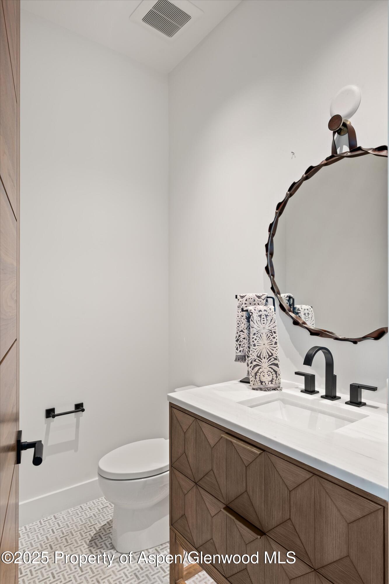 1234 Wood Road Snowmass Village, CO 81615 - Photo 56 of 66 a bathroom with a sink and a toilet