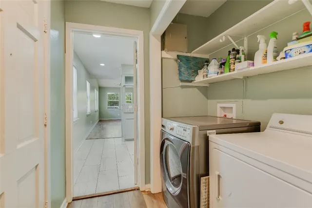 a view of storage and utility room with washer and dryer