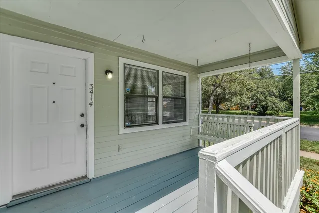 a view of deck with flat screen tv and stairs