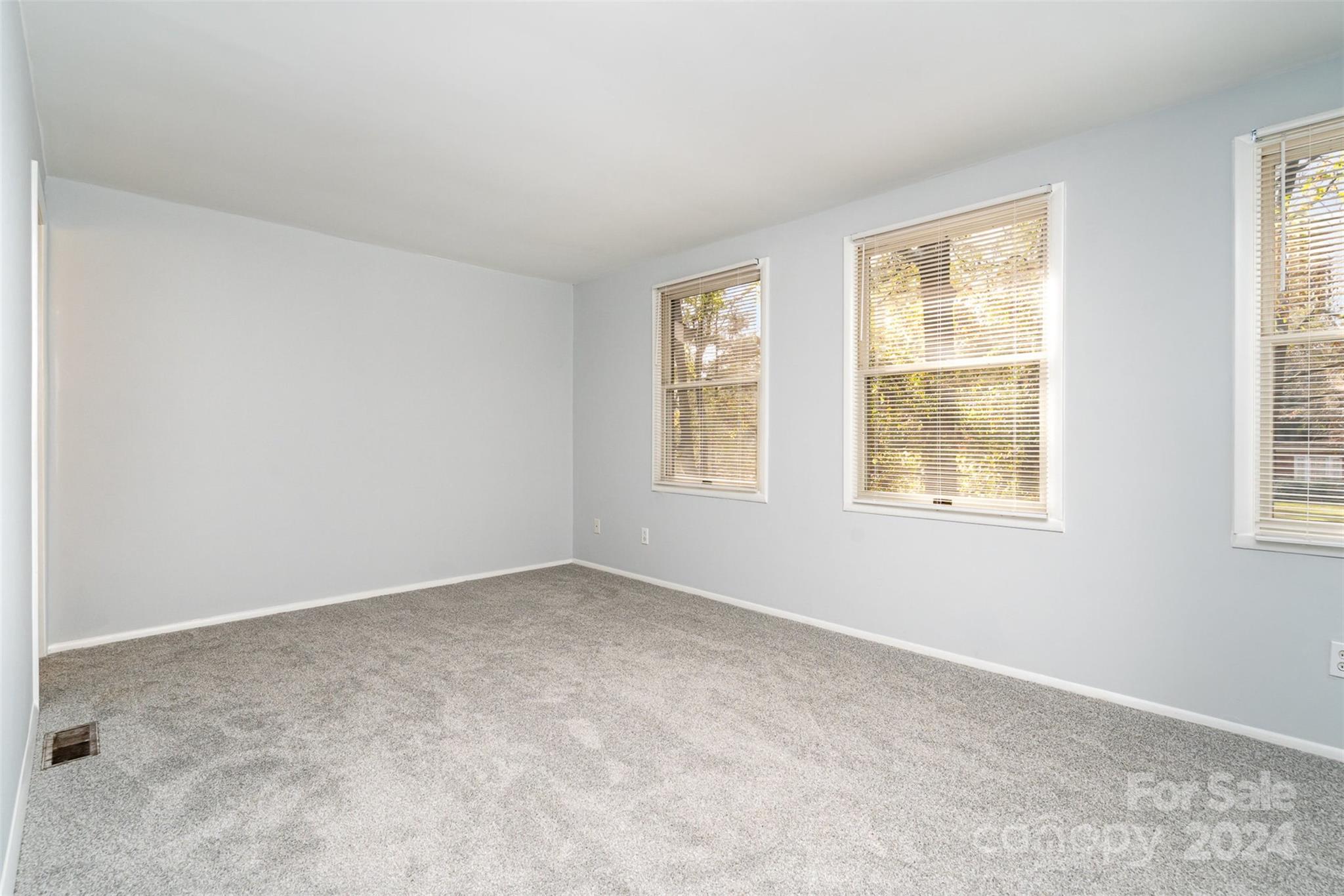 1101 Scaleybark Road, Unit B Charlotte, NC 28209 - Photo 11 of 18 an empty room with windows