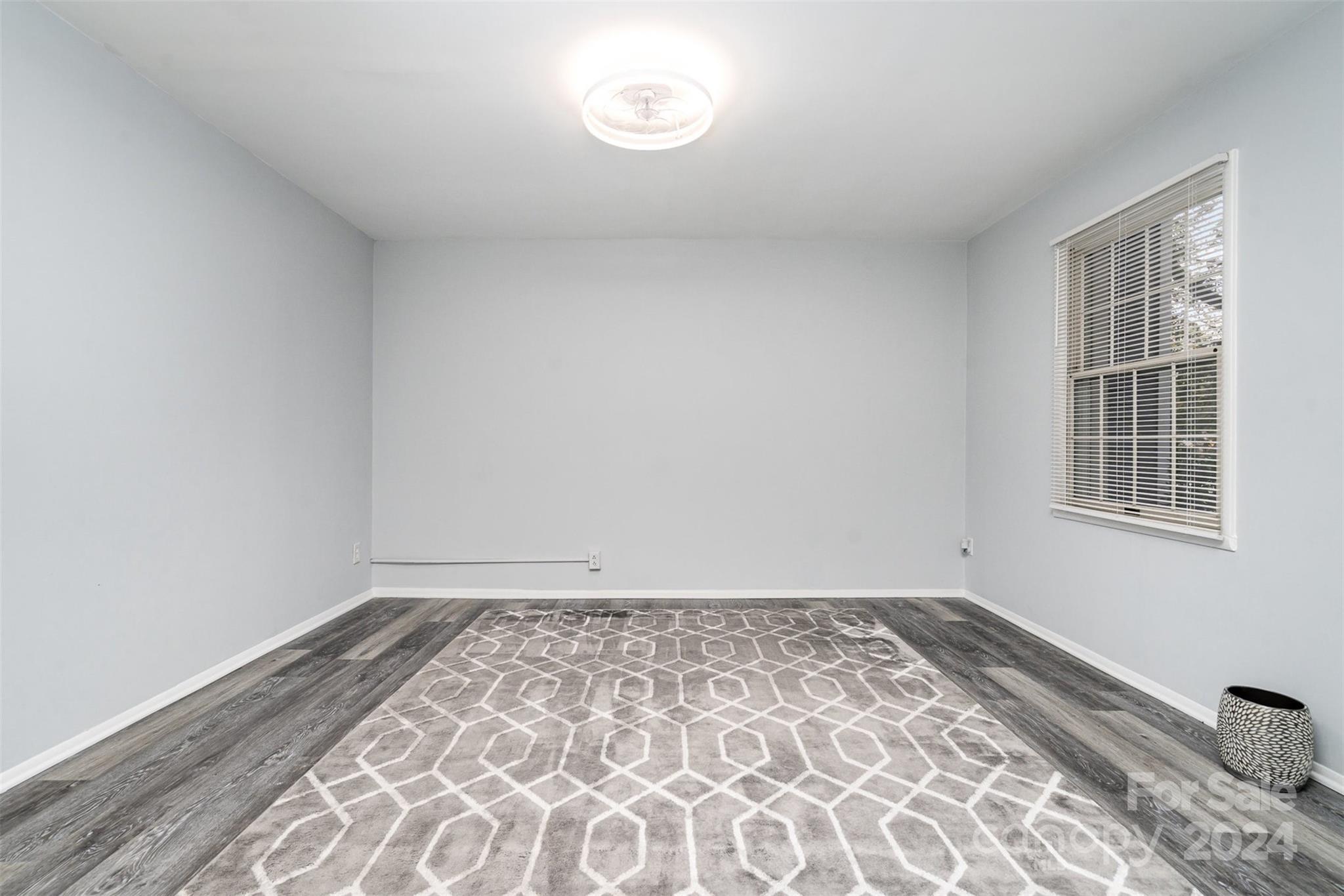1101 Scaleybark Road, Unit B Charlotte, NC 28209 - Photo 2 of 18 a view of empty room with wooden floor