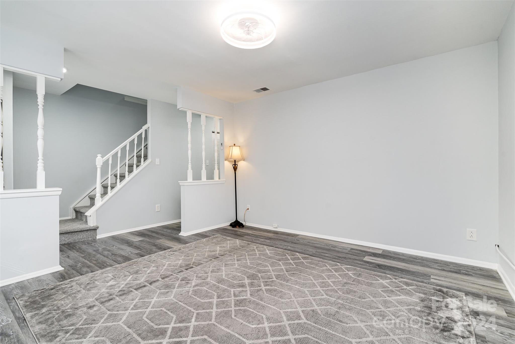 1101 Scaleybark Road, Unit B Charlotte, NC 28209 - Photo 4 of 18 a view of an empty room with stairs