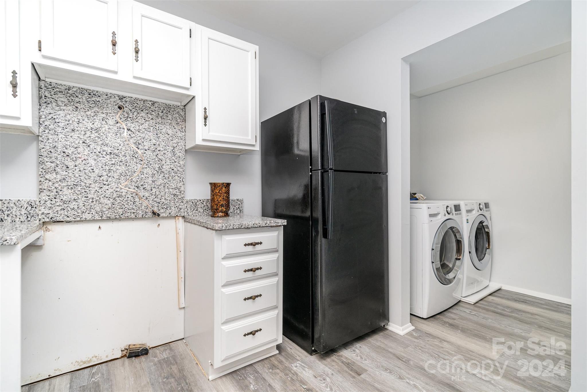 1101 Scaleybark Road, Unit B Charlotte, NC 28209 - Photo 8 of 18 a utility room with dryer and washer