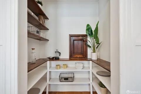 a kitchen with a stove a sink and a microwave