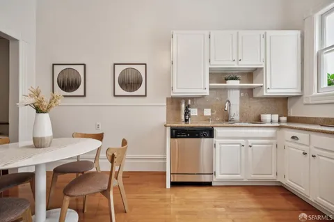 a kitchen with cabinets and steel stainless steel appliances