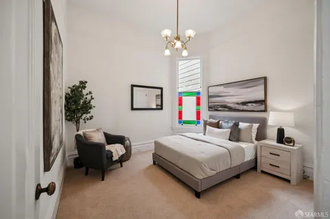 a bedroom with a bed and window