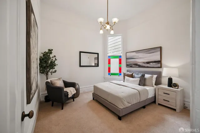 a bedroom with a bed and window