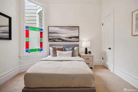 a lamp on a table with a chandelier