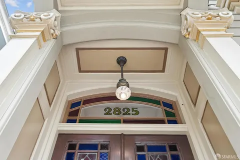 a view of a hallway with seating area