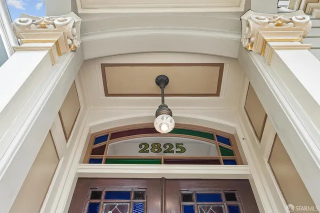 a view of a hallway with seating area