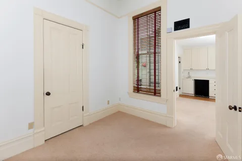 a bathroom with a sink and mirror with toilet