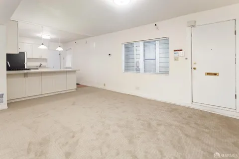 a white refrigerator freezer sitting in a kitchen