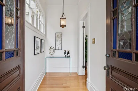 a living room with furniture potted plant and a fireplace