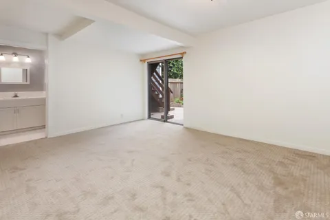 a utility room with cabinets washer and dryer