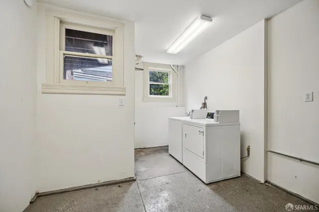 a front view of a residential apartment building with a yard