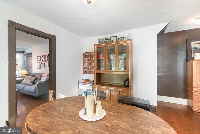 a bathroom with a granite countertop sink a toilet and a mirror