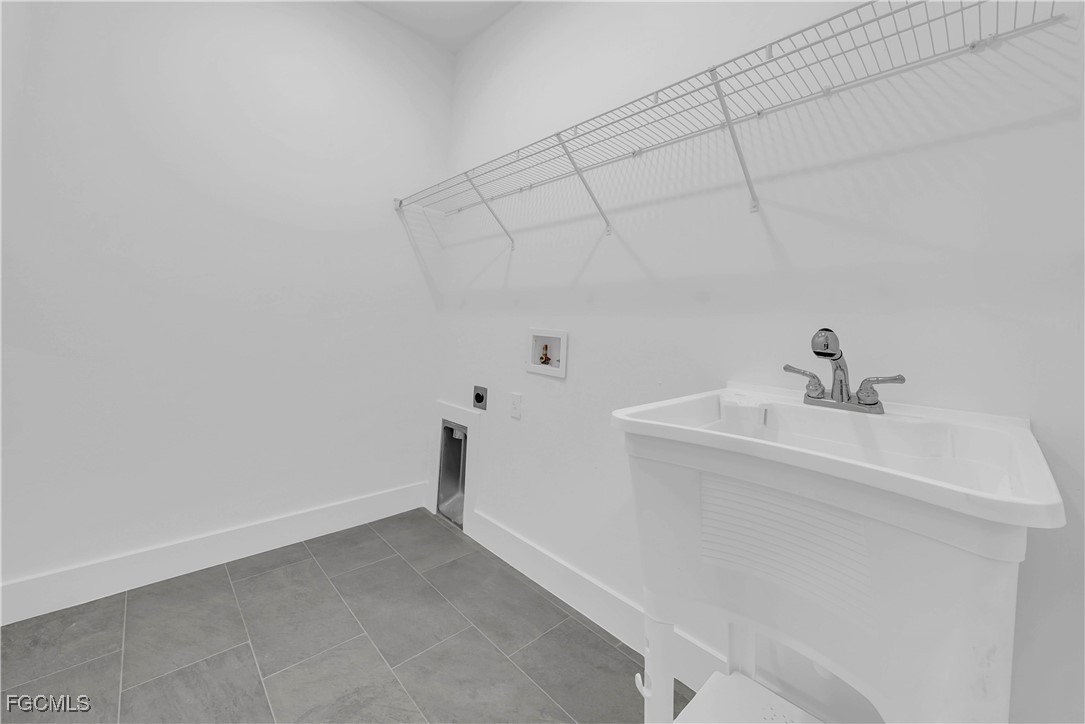 3224 53rd Street West Lehigh Acres, FL 33971 - Photo 13 of 14 a view of a sink and closet with window