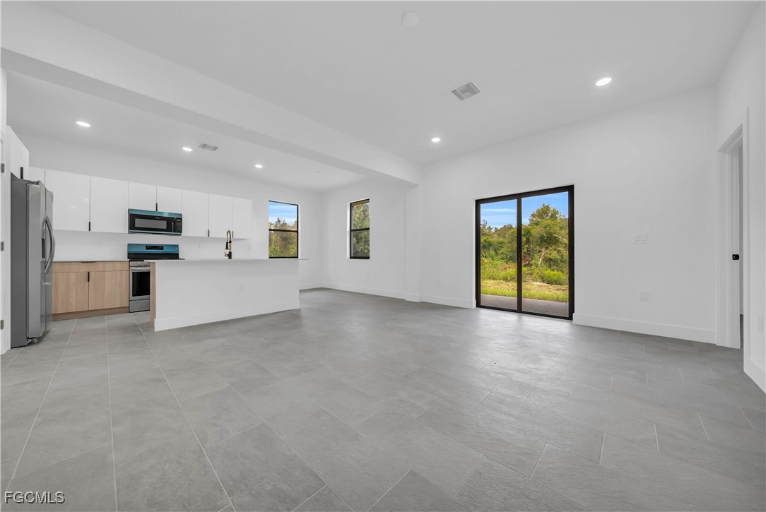 3224 53rd Street West Lehigh Acres, FL 33971 - Photo 2 of 22 a view of an empty room with a window