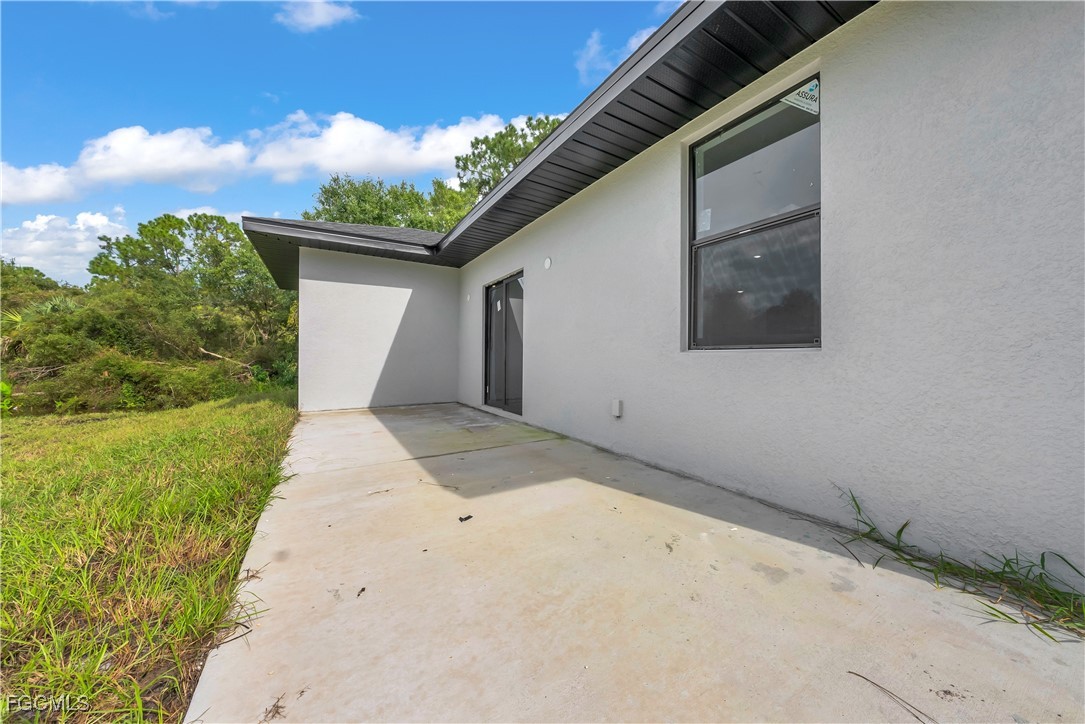 3224 53rd Street West Lehigh Acres, FL 33971 - Photo 21 of 22 a backyard of a house with lots of green space