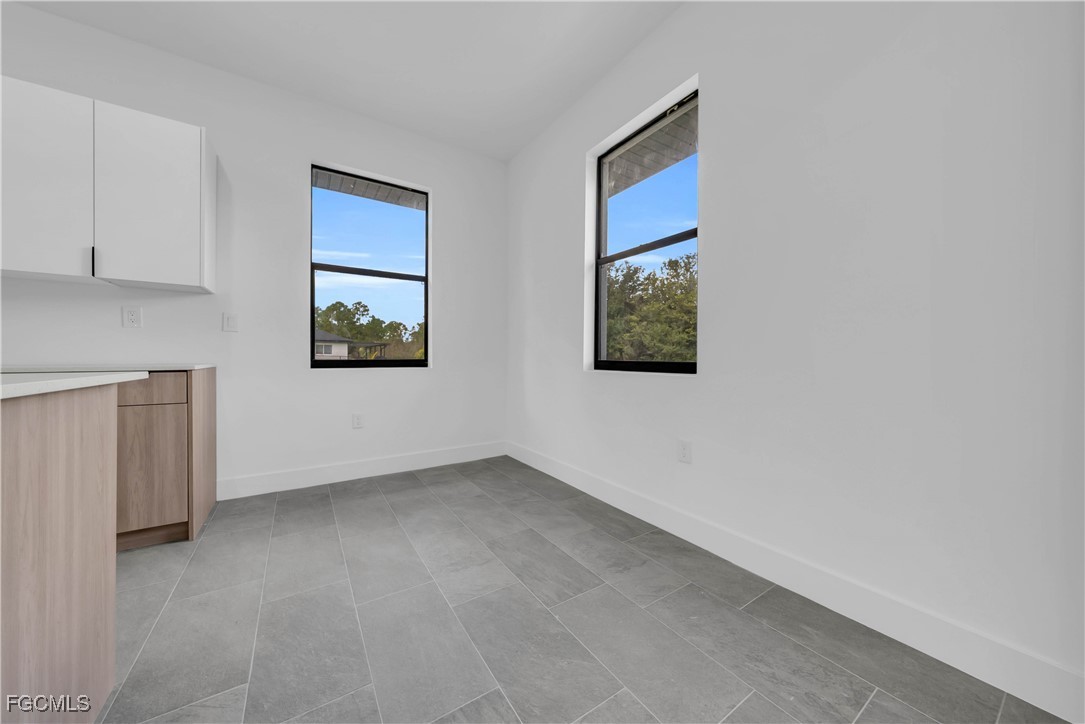 3224 53rd Street West Lehigh Acres, FL 33971 - Photo 9 of 22 a view of an empty room with window
