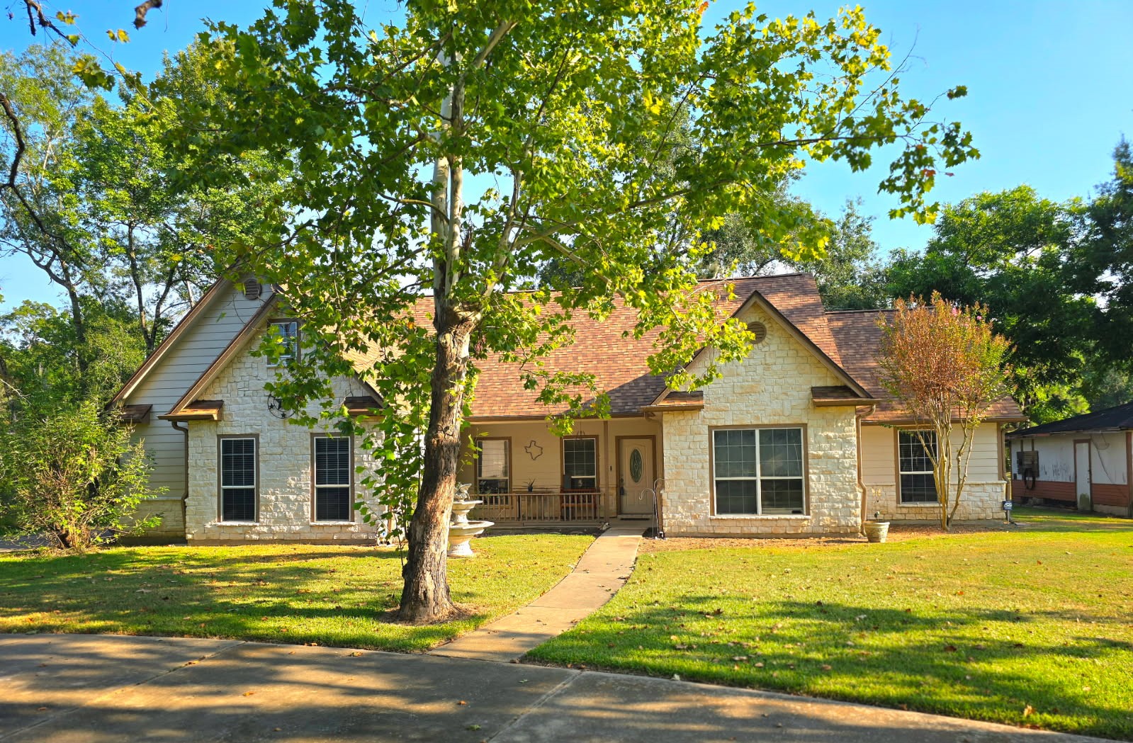 11692 Clark Lane Conroe, TX 77385 - Photo 1 of 35 Charming home on 2.2 UNRESTRICTED acres with a pond for true country living. Home was built in 2002. Beautiful stone elevation with front porch!