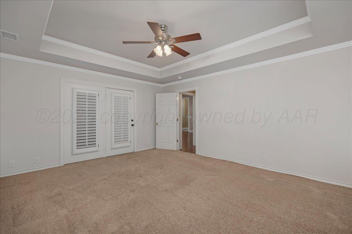5823 Nicholas Circle Amarillo, TX 79109 - Photo 16 of 31 a view of an empty room with a ceiling fan