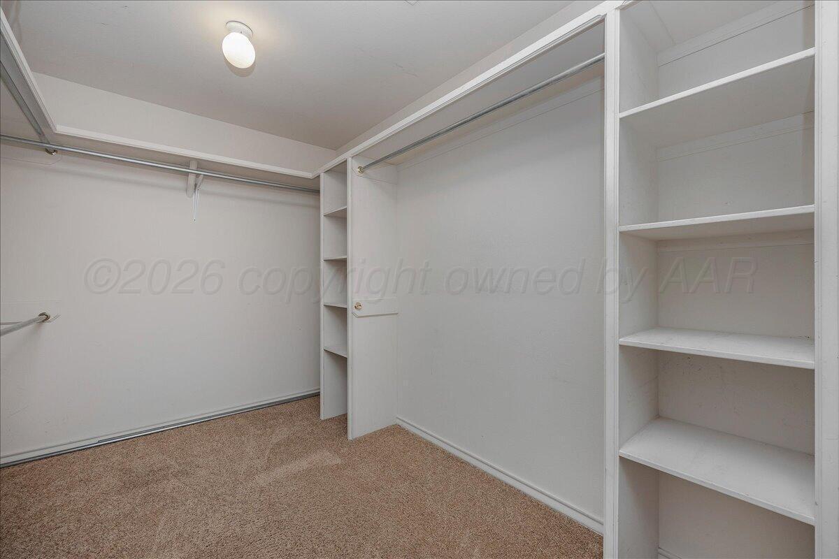 5823 Nicholas Circle Amarillo, TX 79109 - Photo 19 of 31 a view of an empty walk in closet