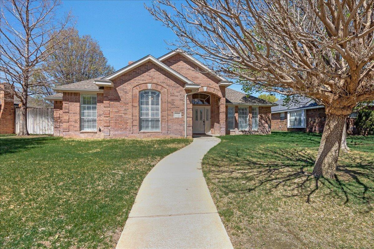 5823 Nicholas Circle Amarillo, TX 79109 - Photo 2 of 31 a front view of a house with garden