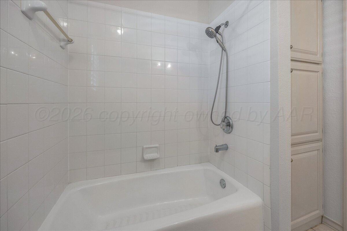 5823 Nicholas Circle Amarillo, TX 79109 - Photo 23 of 31 a close view of a bathtub in a bathroom
