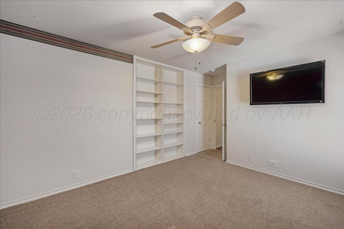 5823 Nicholas Circle Amarillo, TX 79109 - Photo 25 of 31 an empty room with closet fan and windows