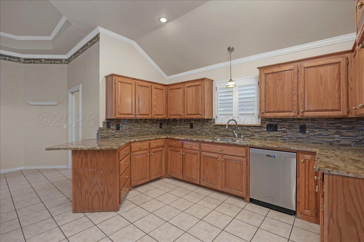 5823 Nicholas Circle Amarillo, TX 79109 - Photo 10 of 31 a kitchen with stainless steel appliances granite countertop a sink and cabinets