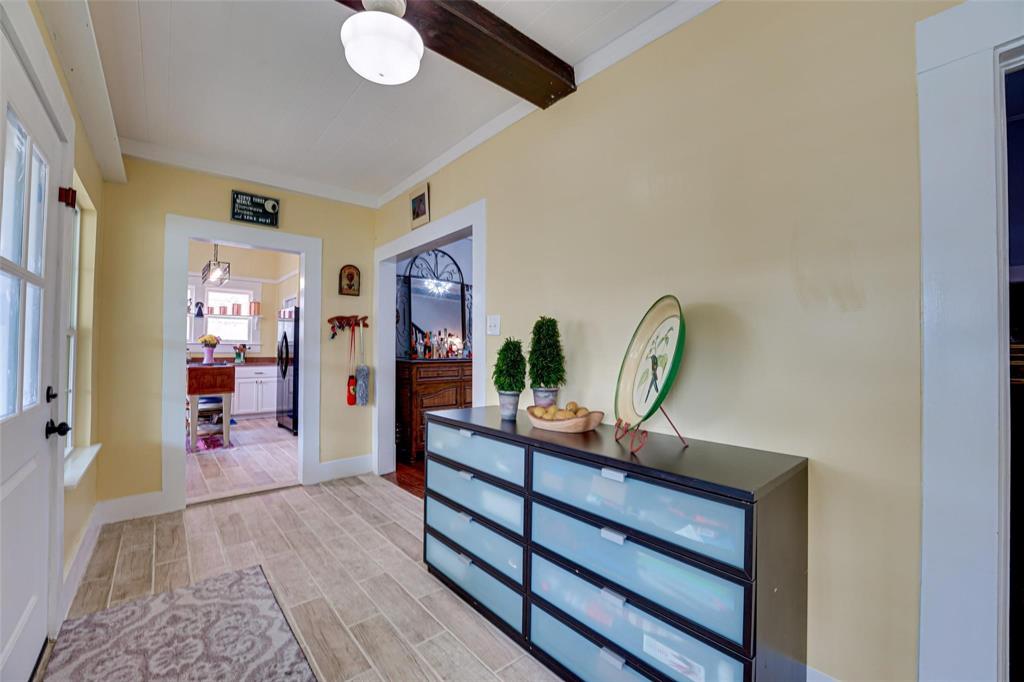 1515 Caddo Street Commerce, TX 75428 - Photo 11 of 23 a view of a hallway to a livingroom with furniture