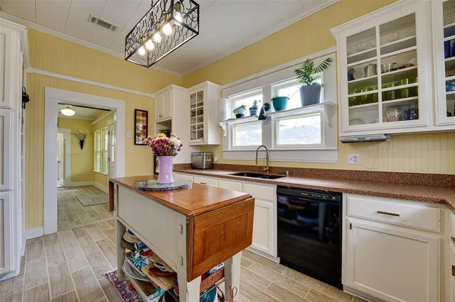 a kitchen with stainless steel appliances granite countertop a stove and a sink