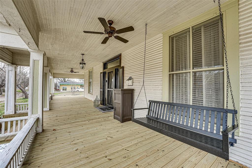1515 Caddo Street Commerce, TX 75428 - Photo 3 of 23 a view of a balcony with wooden floor