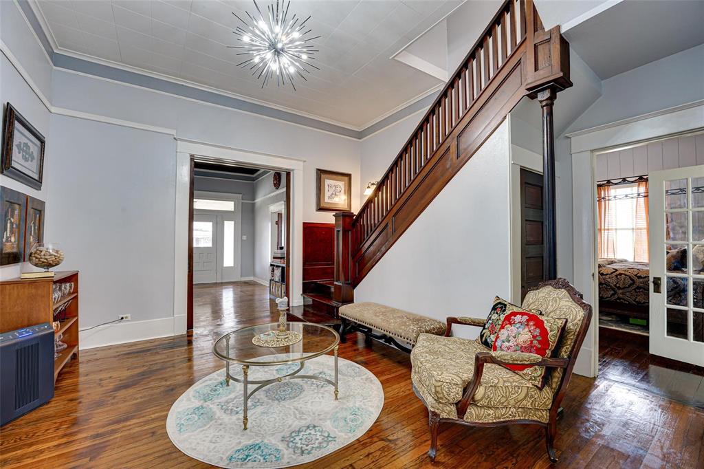 1515 Caddo Street Commerce, TX 75428 - Photo 5 of 23 a living room with furniture and wooden floor