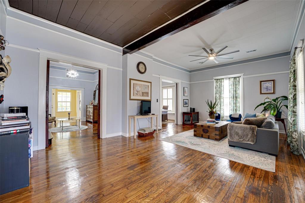 1515 Caddo Street Commerce, TX 75428 - Photo 6 of 23 a living room with furniture and wooden floor