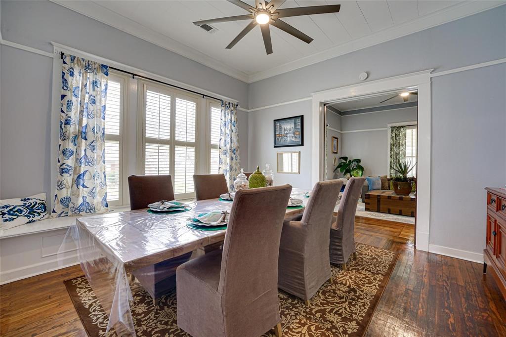 1515 Caddo Street Commerce, TX 75428 - Photo 10 of 23 a view of a dining room with furniture window and wooden floor