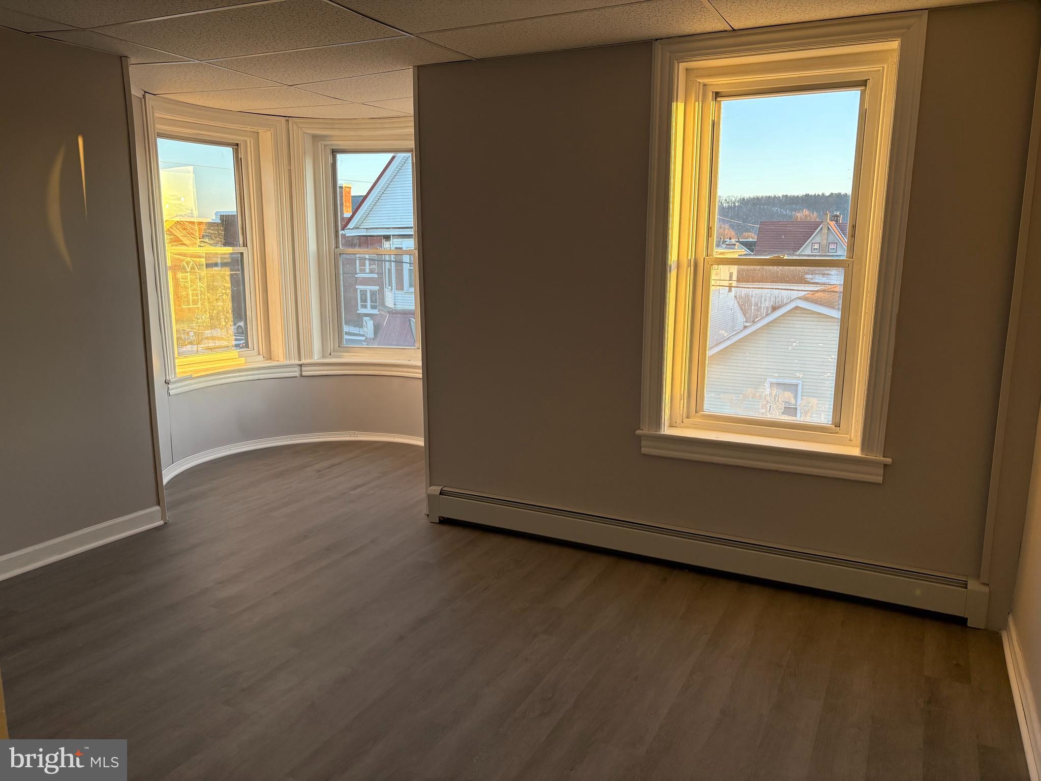 404 Mahoning Street, Unit 2 Lehighton, PA 18235 - Photo 3 of 9 a view of an empty room with wooden floor and a window