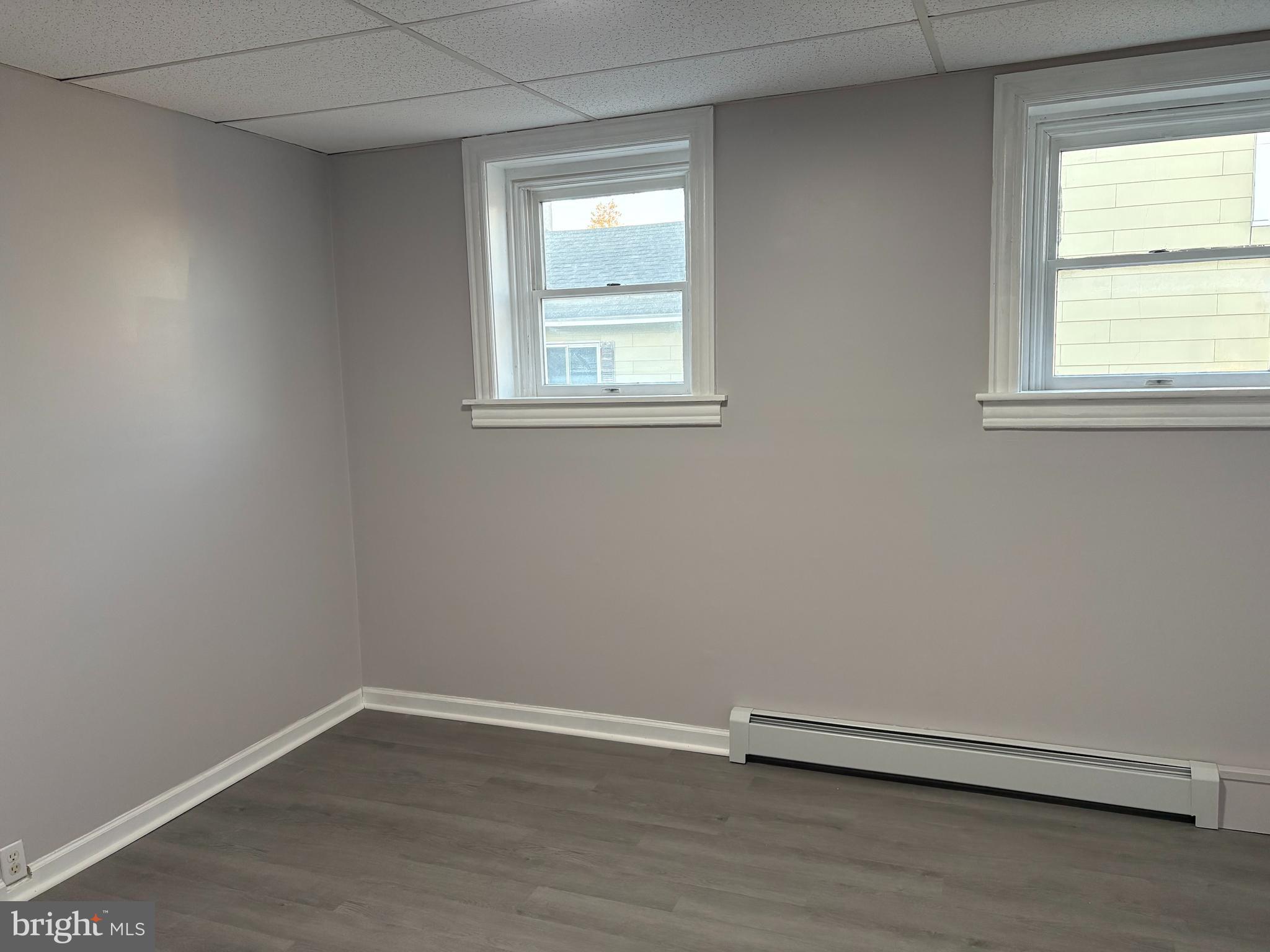 404 Mahoning Street, Unit 2 Lehighton, PA 18235 - Photo 4 of 9 an empty room with wooden floor and windows