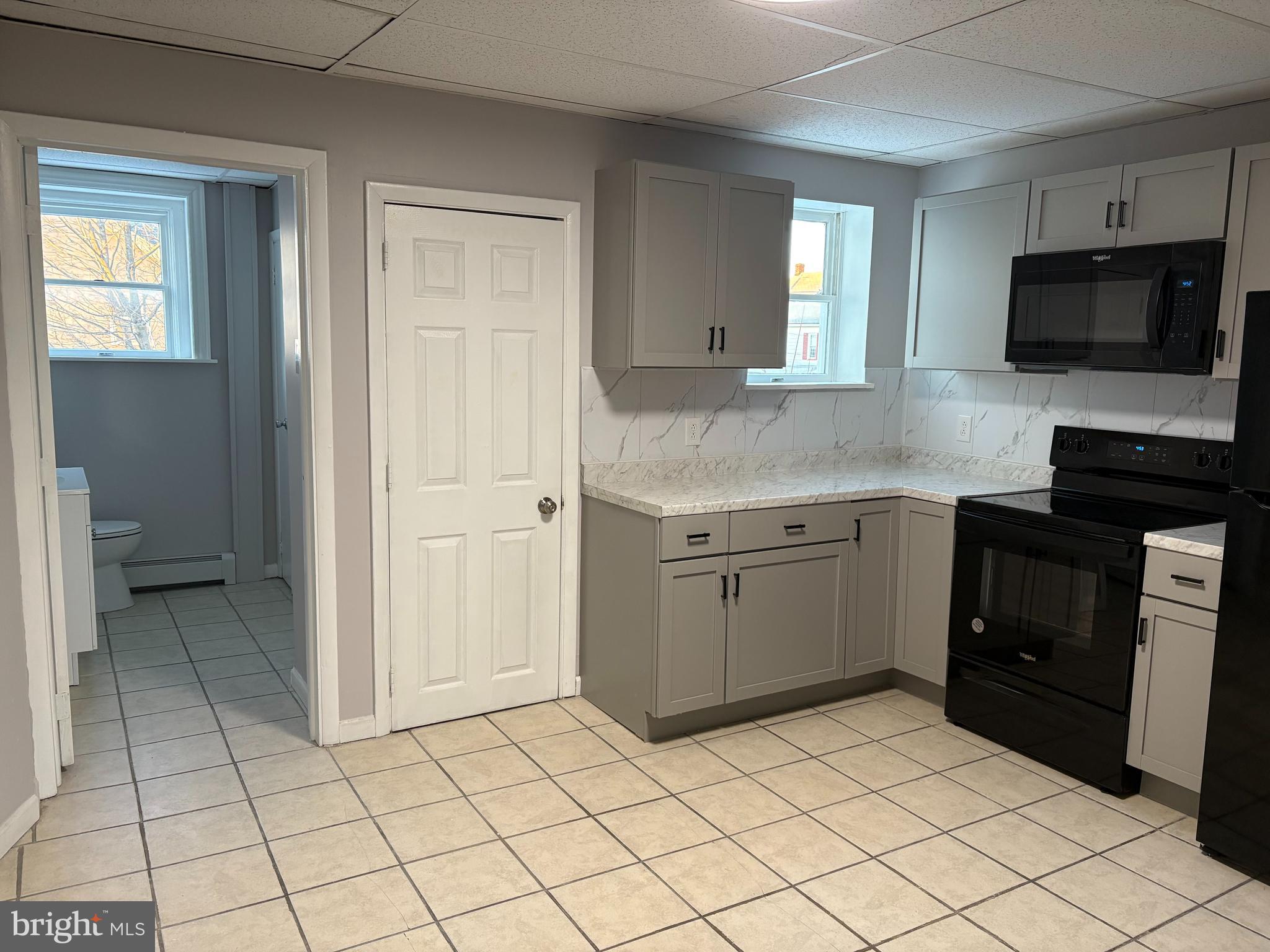 404 Mahoning Street, Unit 2 Lehighton, PA 18235 - Photo 5 of 9 a kitchen with a sink and a stove top oven