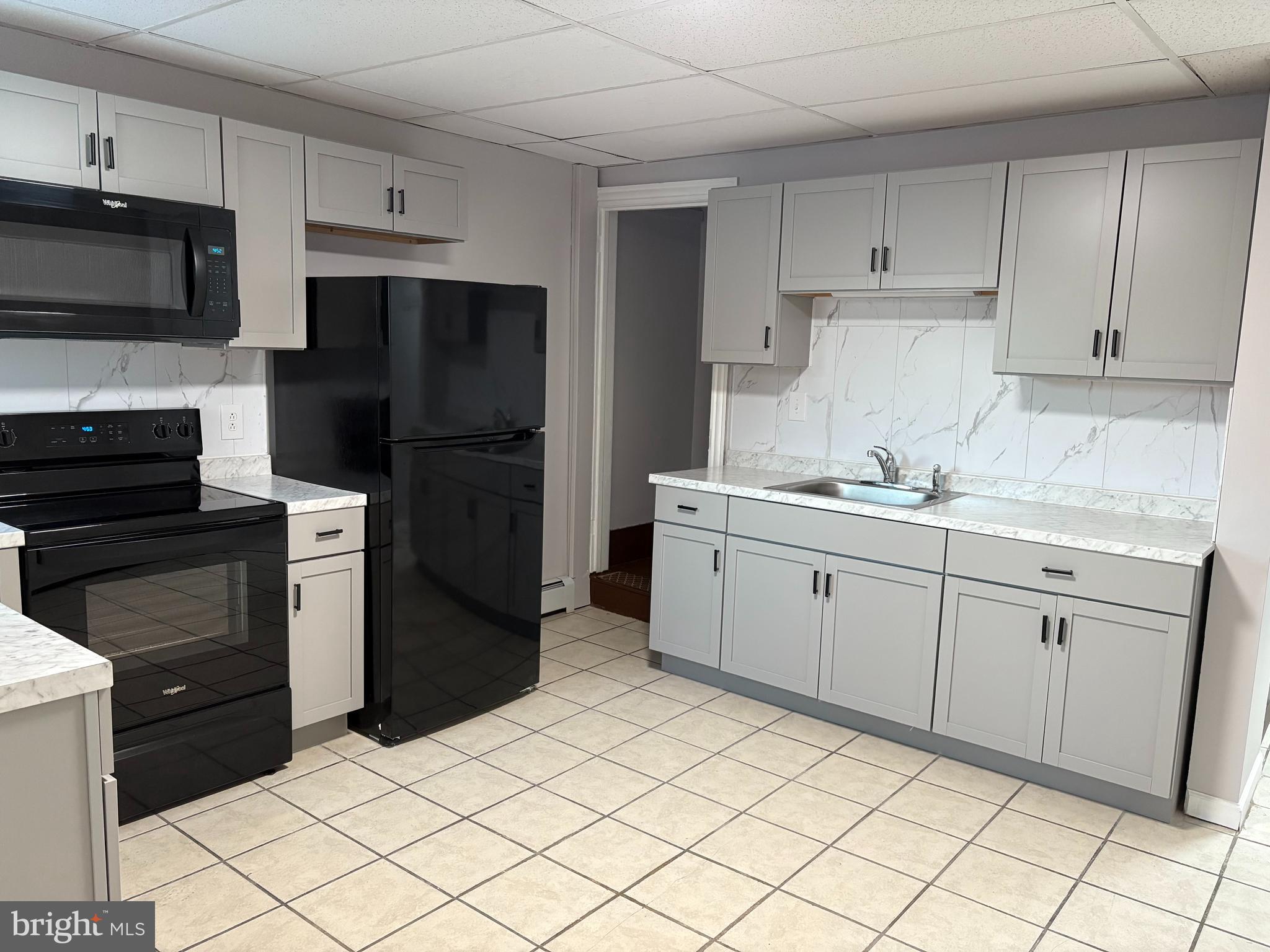 404 Mahoning Street, Unit 2 Lehighton, PA 18235 - Photo 6 of 9 a kitchen with a sink stove and refrigerator