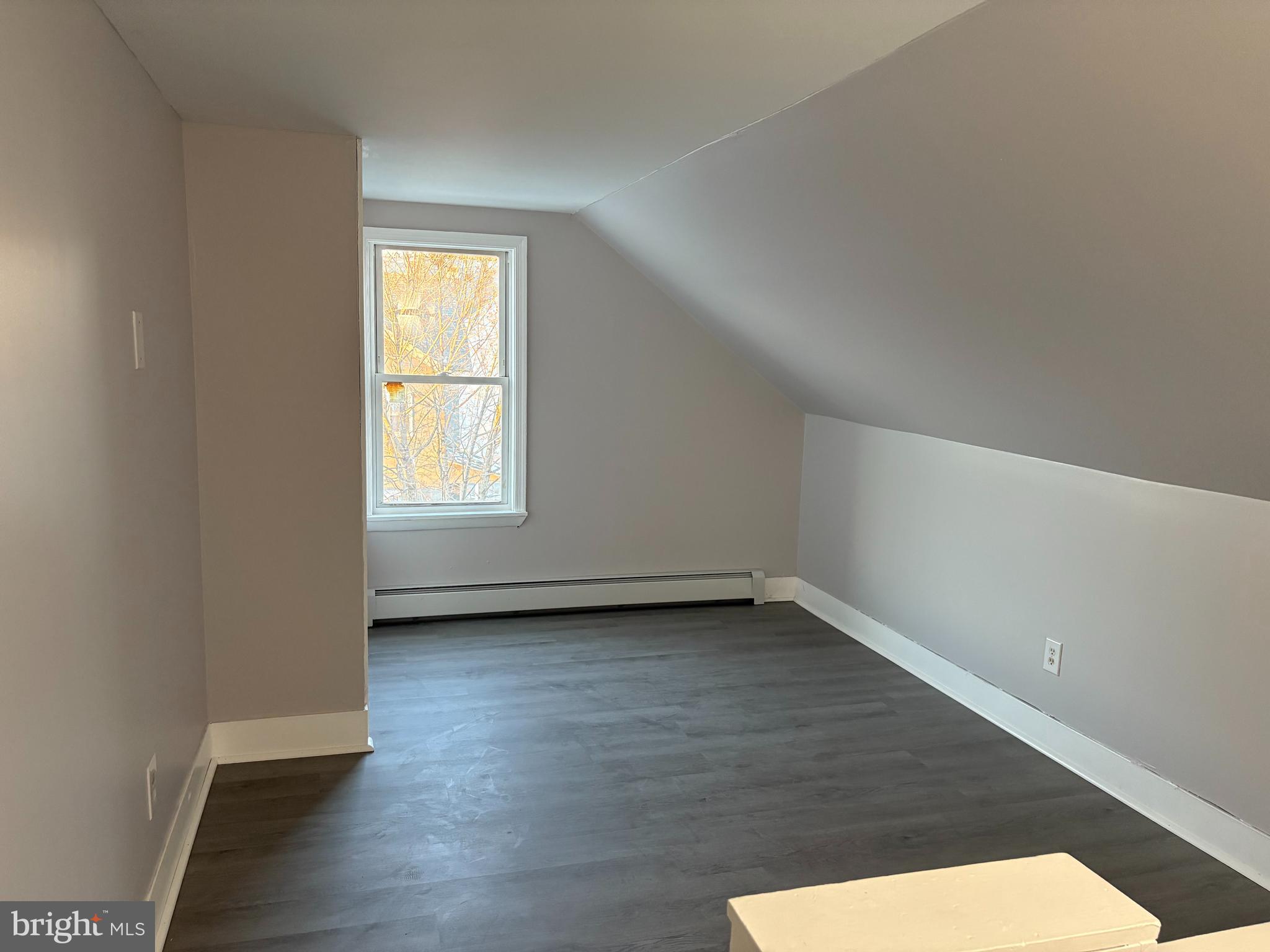 404 Mahoning Street, Unit 2 Lehighton, PA 18235 - Photo 8 of 9 an empty room with wooden floor and windows