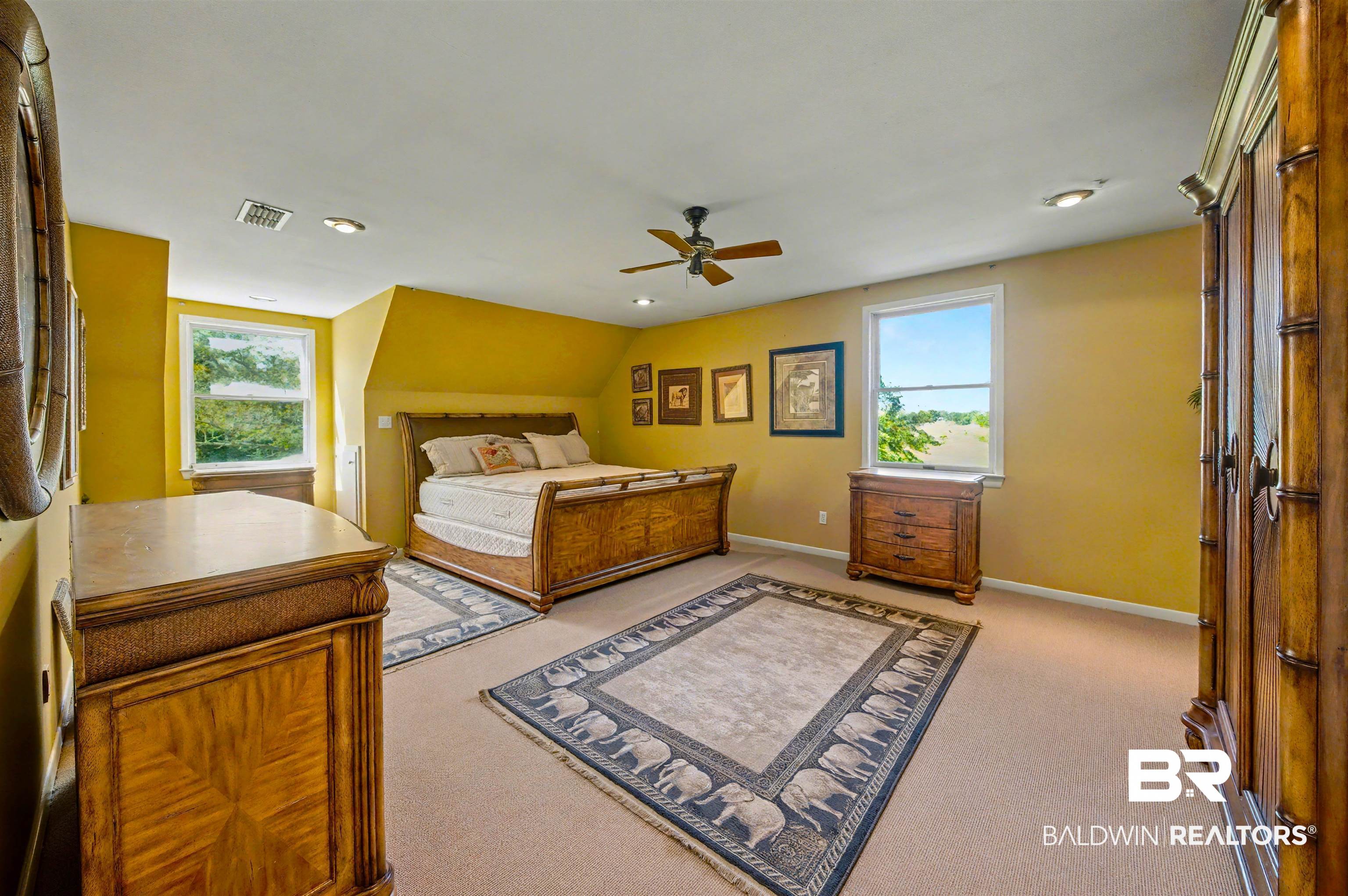 15810 County Road 73 Foley, AL 36535 - Photo 39 of 56 Bedroom featuring a ceiling fan, multiple windows, light carpet, vaulted ceiling, and recessed lighting