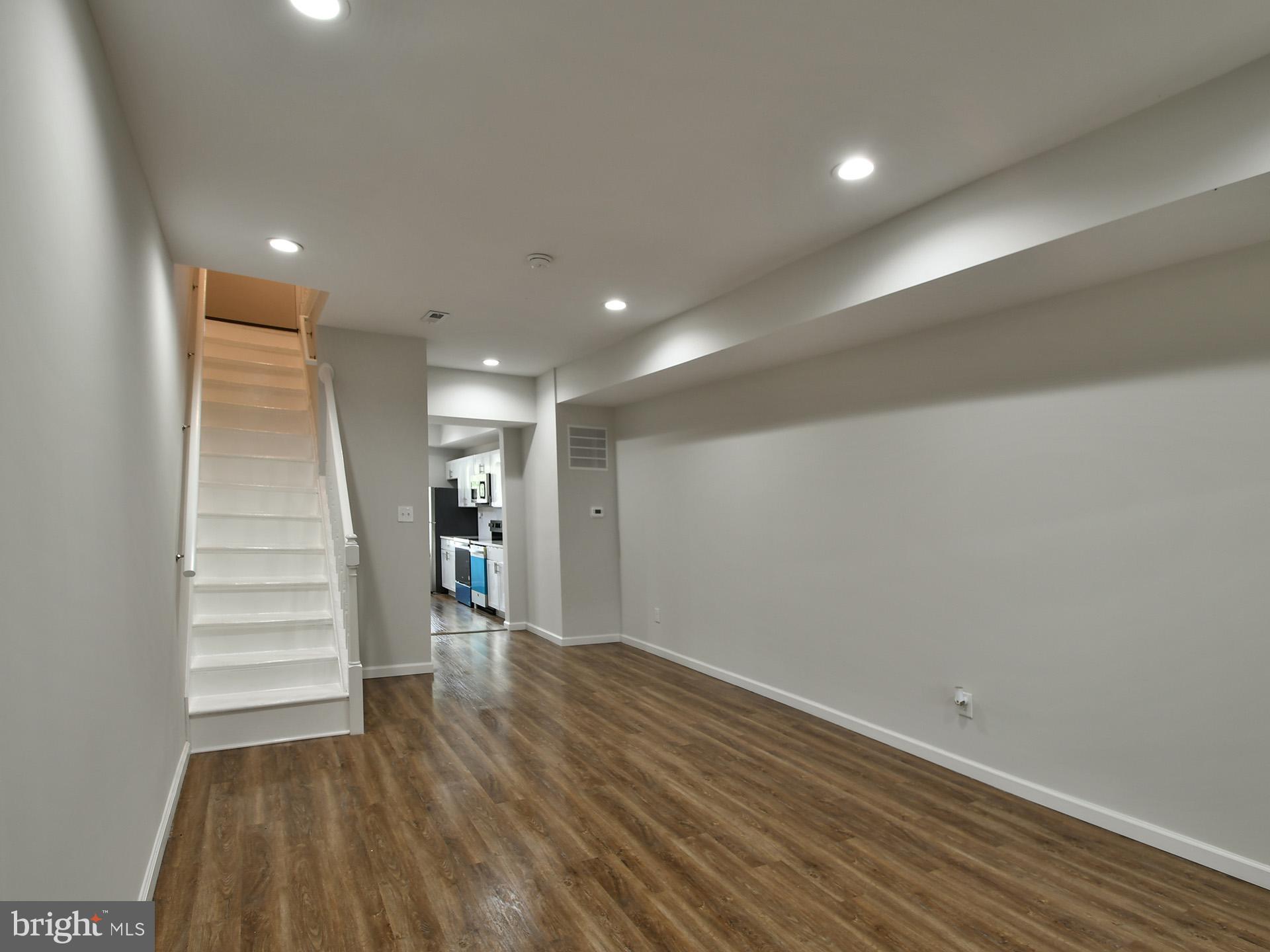 2114 Cliftwood Avenue Baltimore, MD 21213 - Photo 16 of 58 a view of empty room with wooden floor